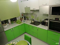 Kitchen in green and white colors photo