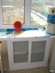 Refrigerator design under the window in the kitchen in Khrushchev photo