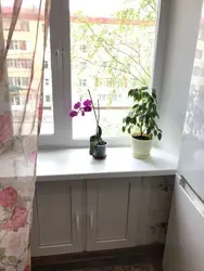 Refrigerator design under the window in the kitchen in Khrushchev photo