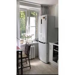 Kitchen design with refrigerator by the window