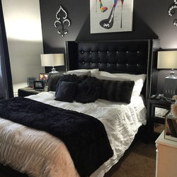 Black bed in the bedroom interior photo