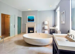 Photo of a bathroom with a bathtub in the middle