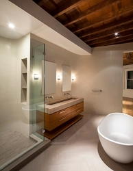 Photo of a bathroom with a bathtub in the middle