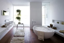 Photo of a bathroom with a bathtub in the middle