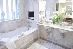 Porcelain tiles for floors and walls in the bathroom photo