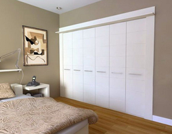 Bedroom design with white wardrobe