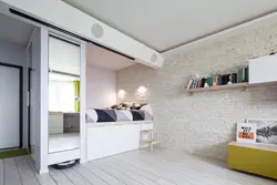 Apartment design with a niche for a bed photo