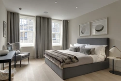 Bedroom with two windows on one wall interior