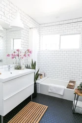 Small bathroom design with white tiles