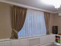 Tulle up to the window sill in a modern bedroom photo