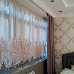 Tulle up to the window sill in a modern bedroom photo