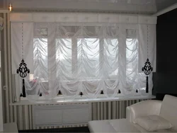 Tulle up to the window sill in a modern bedroom photo