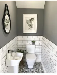 Photo of a toilet in an apartment tile design
