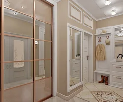 Hallway design with a wardrobe in light colors