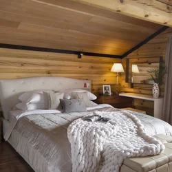 Bedroom in a wooden house made of timber photo