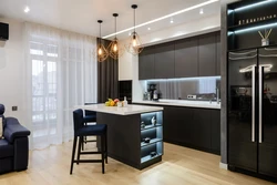 Photo of a dark living room with kitchen