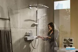 Photo of a bathtub with a rain shower