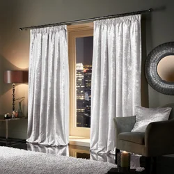 Velvet curtains in the interior of a living room in style