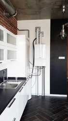 Interior of a small kitchen with a floor-standing boiler