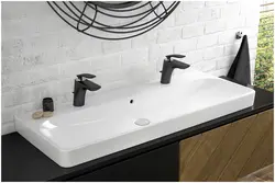 Bathroom with black faucets photo