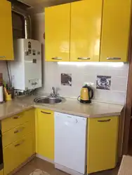 Kitchens in Khrushchev with a gas water heater and a refrigerator photo