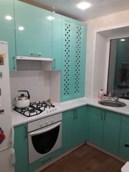 Kitchens in Khrushchev with a gas water heater and a refrigerator photo