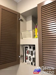 Louvered doors in the bathroom interior