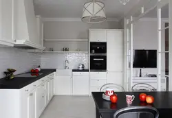 Black appliances in the interior of a light kitchen