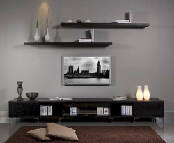 Shelves above the TV in the living room in the interior