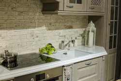 White kitchen with artificial stone photo