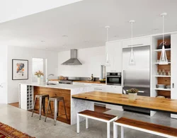 White kitchen and wooden table photo