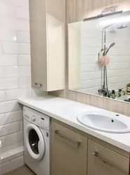 Built-in washing machine in the bathroom photo