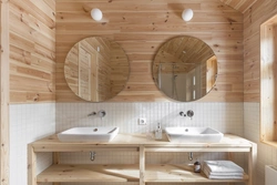 Toilet with bathtub in a wooden house photo design