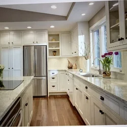 Photo of a kitchen with a window in light colors