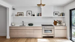 Photo of a kitchen without upper cabinets in style