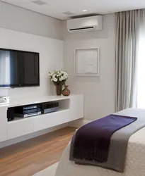 Bedroom interior with bed and tv