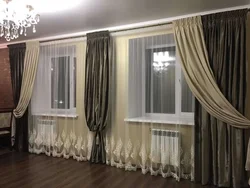 Curtains for two windows with a wall photo in a modern living room