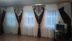 Curtains for two windows with a wall photo in a modern living room