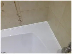 Plinth for bathtub made of tiles photo