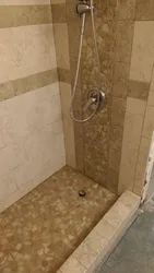 Photo of a bathroom with a tiled shower