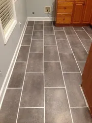 What tile is better to put on the floor in the kitchen photo