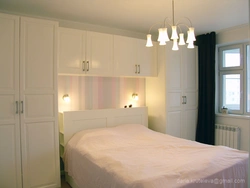 Bed Between Wardrobes In Bedroom Design