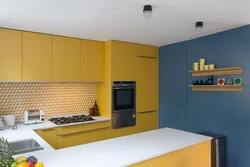 Yellow-blue kitchen in the interior photo