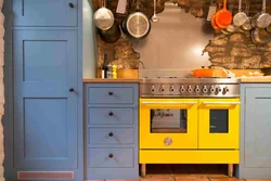 Yellow-blue kitchen in the interior photo