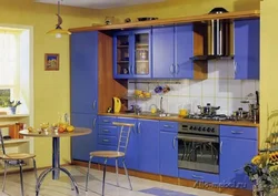 Yellow-blue kitchen in the interior photo
