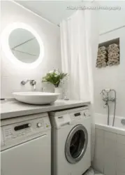 Photo of a small bathtub with a machine