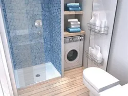 Bathroom with tiled shower and washing machine photo