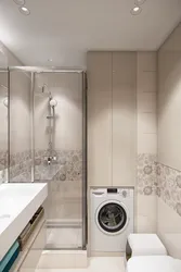 Bathroom with tiled shower and washing machine photo