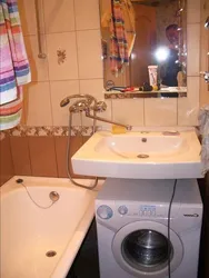 Bath interior in Khrushchev with washing machine photo