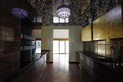 Black glossy stretch ceiling in the kitchen photo